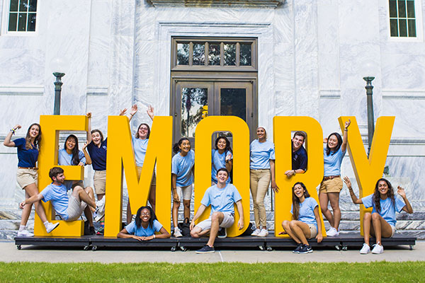 students-at-yellow-emory-sign-3by2.jpg