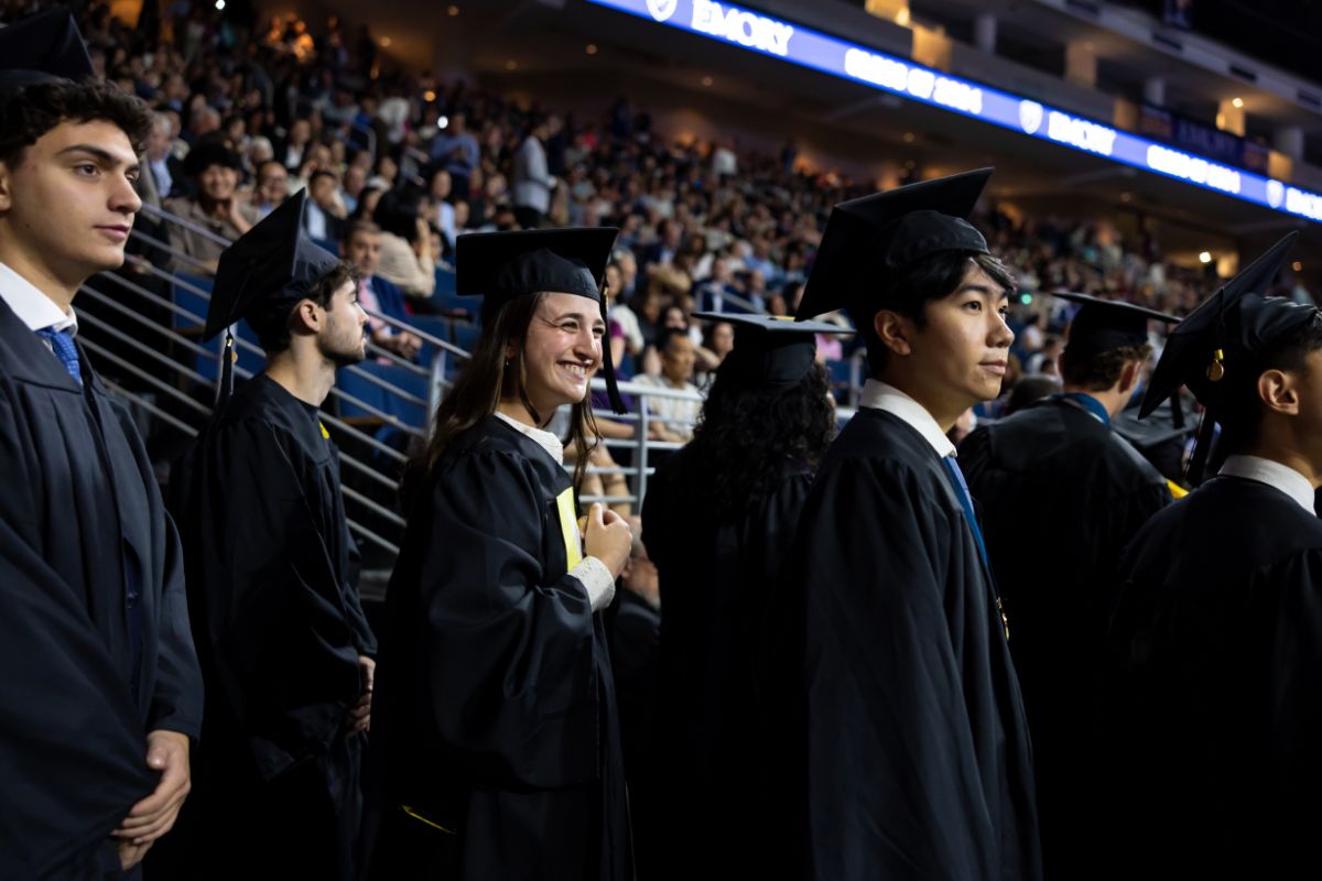 Students in caps and gowns attend Emory's 2024 Commencement ceremony at the Gas South Arena