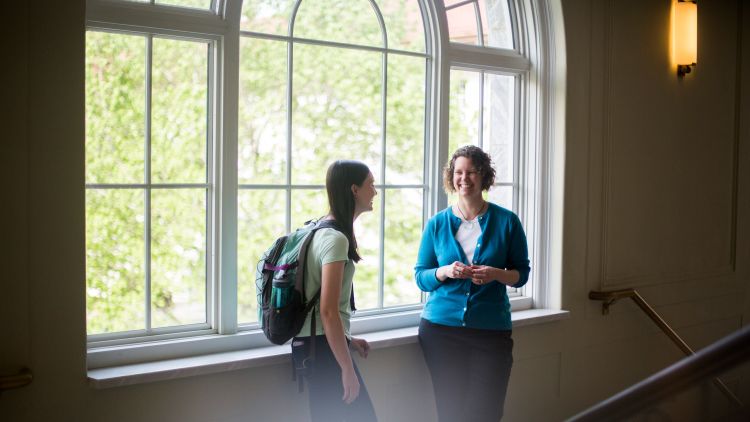 Director of Undergraduate Studies and Lecturer at Emory College, Amanda Freeman with Emory college student Kaitlyn Oelkers in front of window in Candler Library