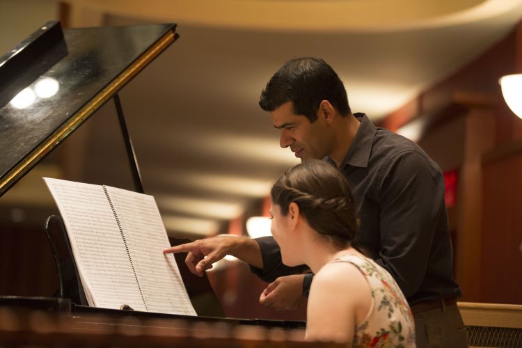 Paul Bhasin and student at piano at Schwartz Center for Performing Arts, Emerson Hall