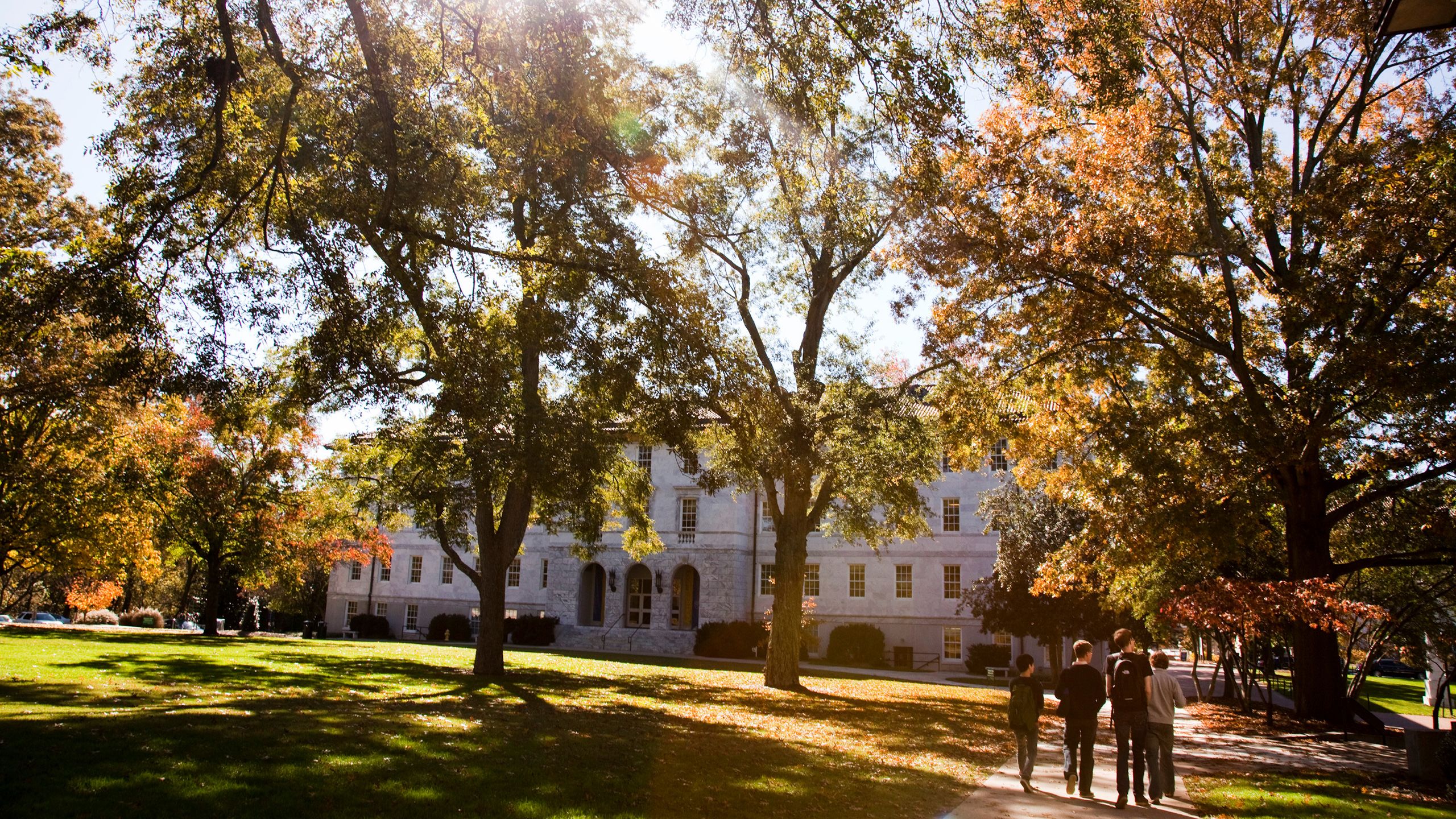 group of boys walking across the quad