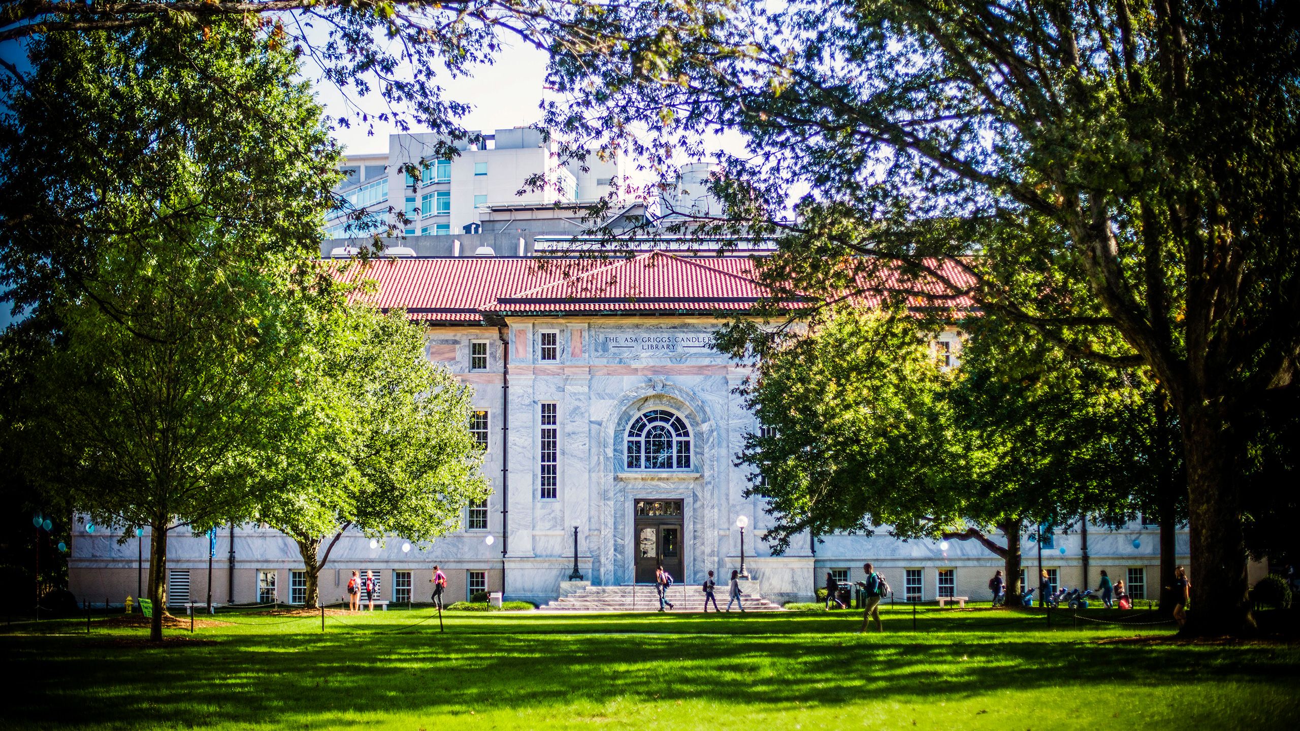 view of students walking in front of Candler Library from the quad