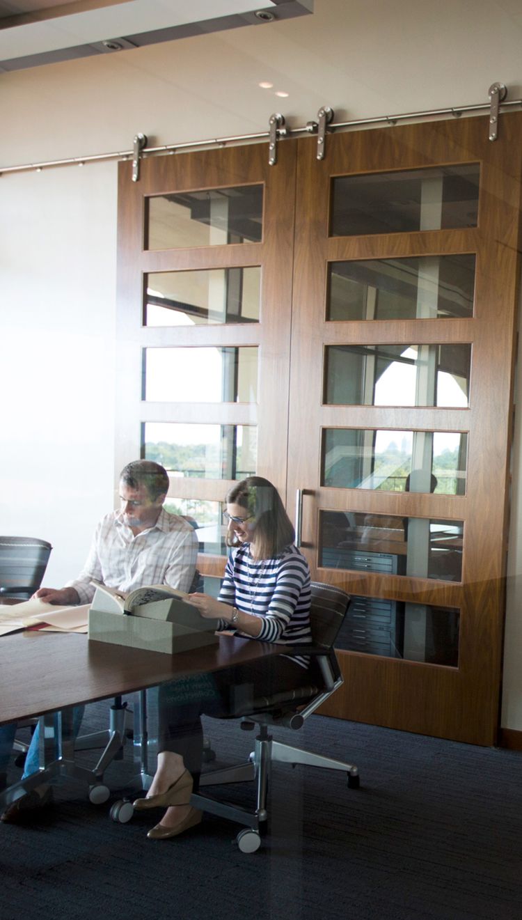 students in Rose Library viewing manuscripts