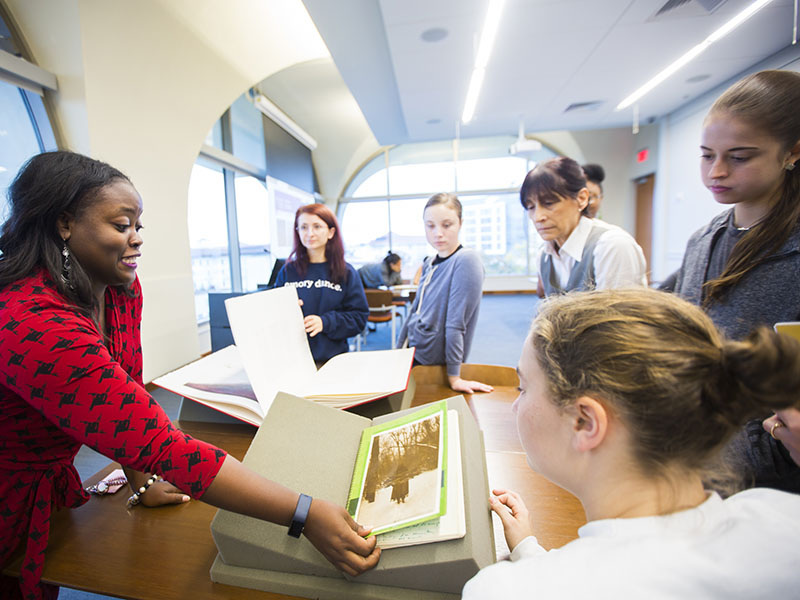 undergraduate students gathering research in the Rose Library